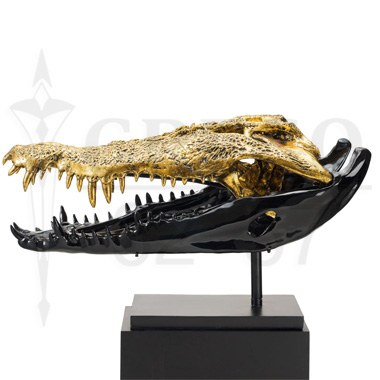 crocodile skulls in resin and bronze-worked gold leaf