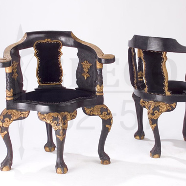 Exotic, seated wooden armchairs to velour, decorated in the gold leaf. </br> © RODRIGUE GREGO